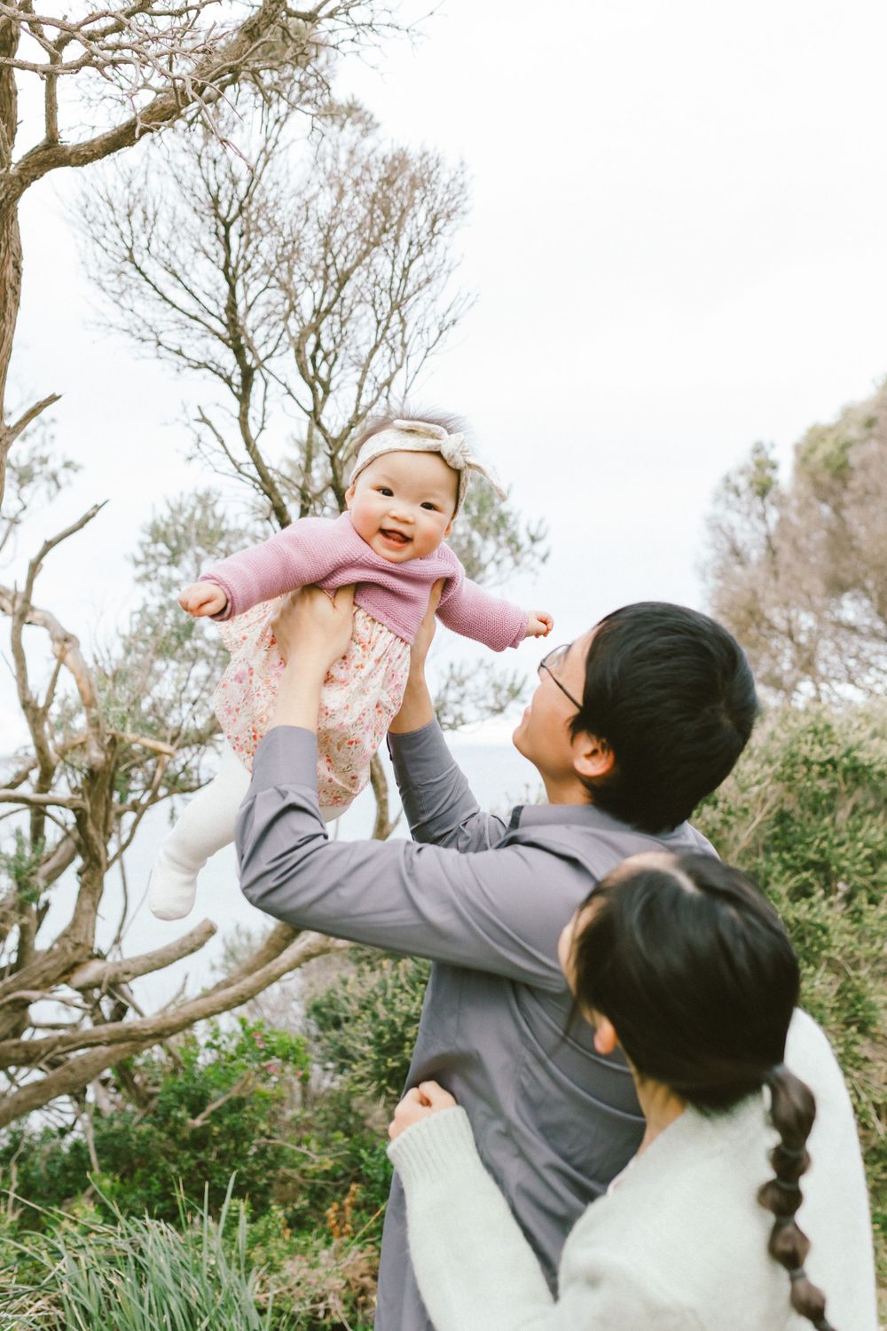 A series of joyful moments captured outdoors showing playful interaction between parent and child in a natural setting.
