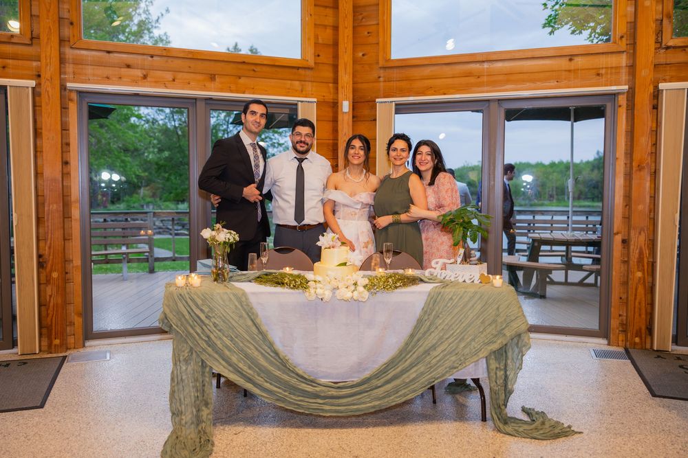 Group photo near a lake at a wedding party