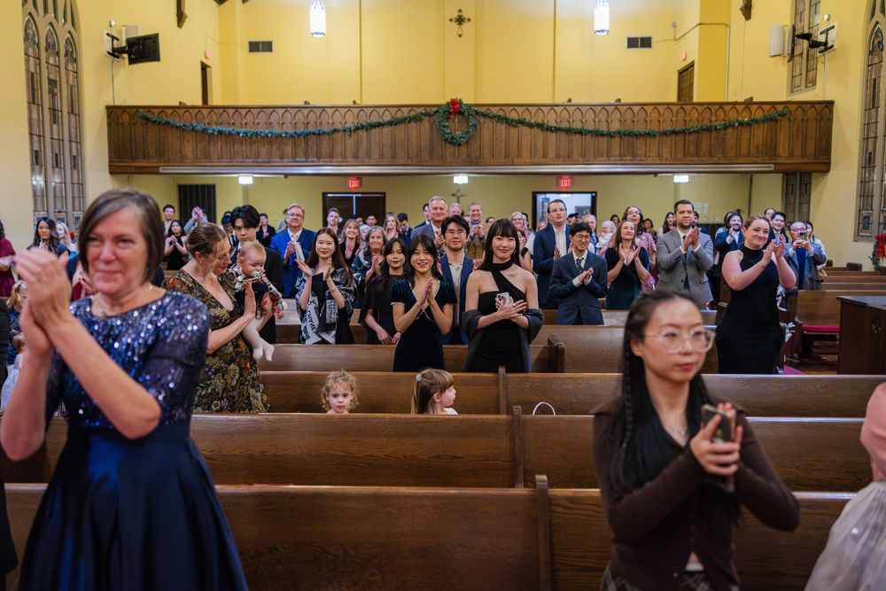 Audience and family clapping at a wedding ceremony in Champaign, IL