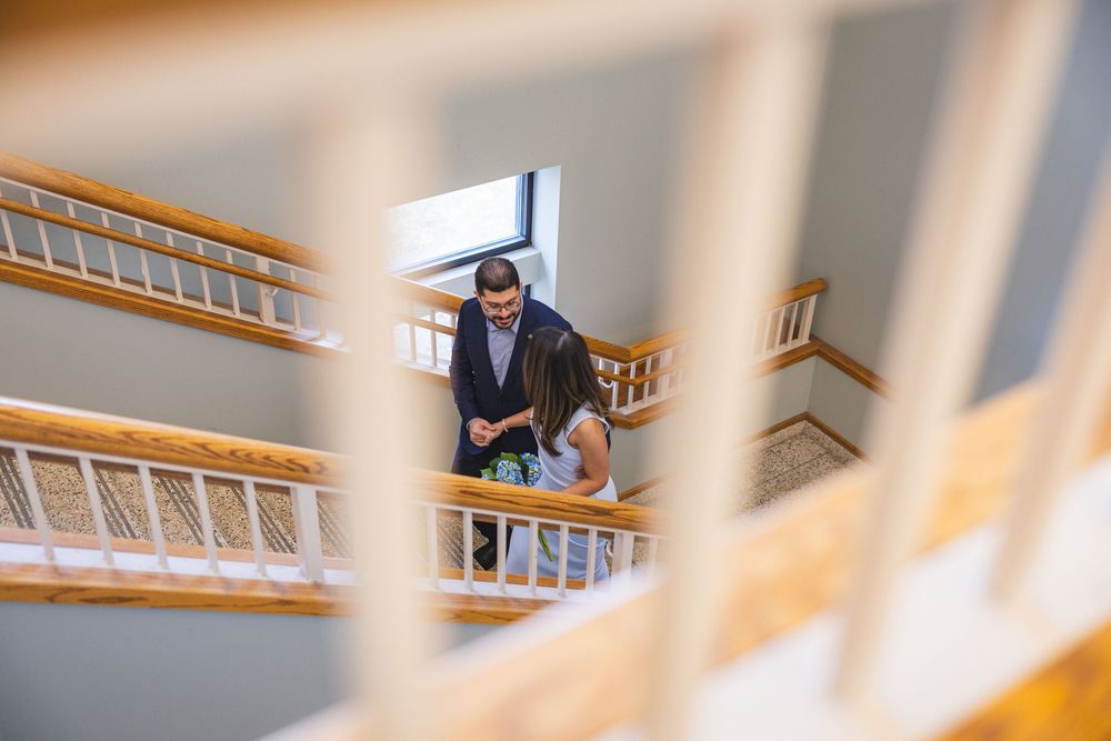 Wedding photos at the Champaign County Courthouse walking up the stairs