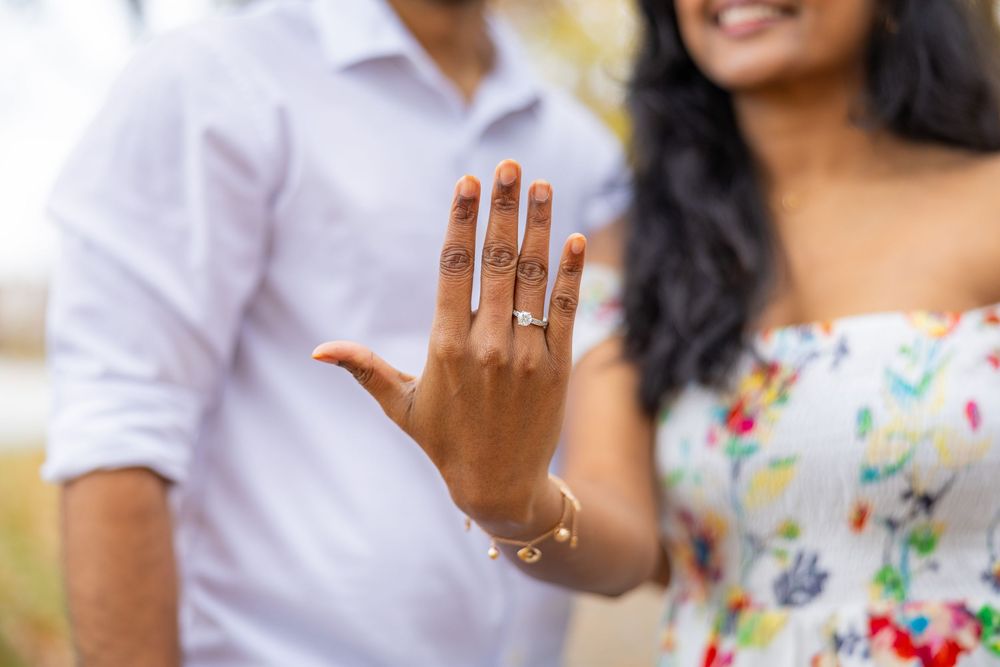 Just engaged couple showing off their engagement right