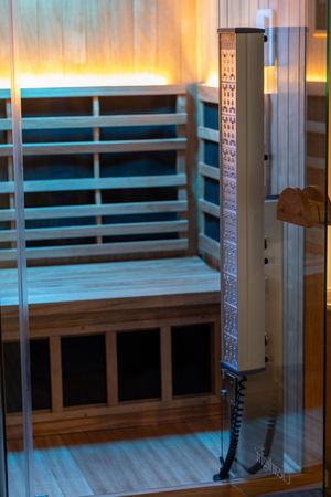 Modern spa interior with wooden benches and ambient lighting creating a relaxing atmosphere.
