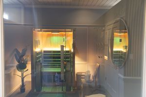 Sleek and minimalist spa corridor with modern lighting and glass partitions.