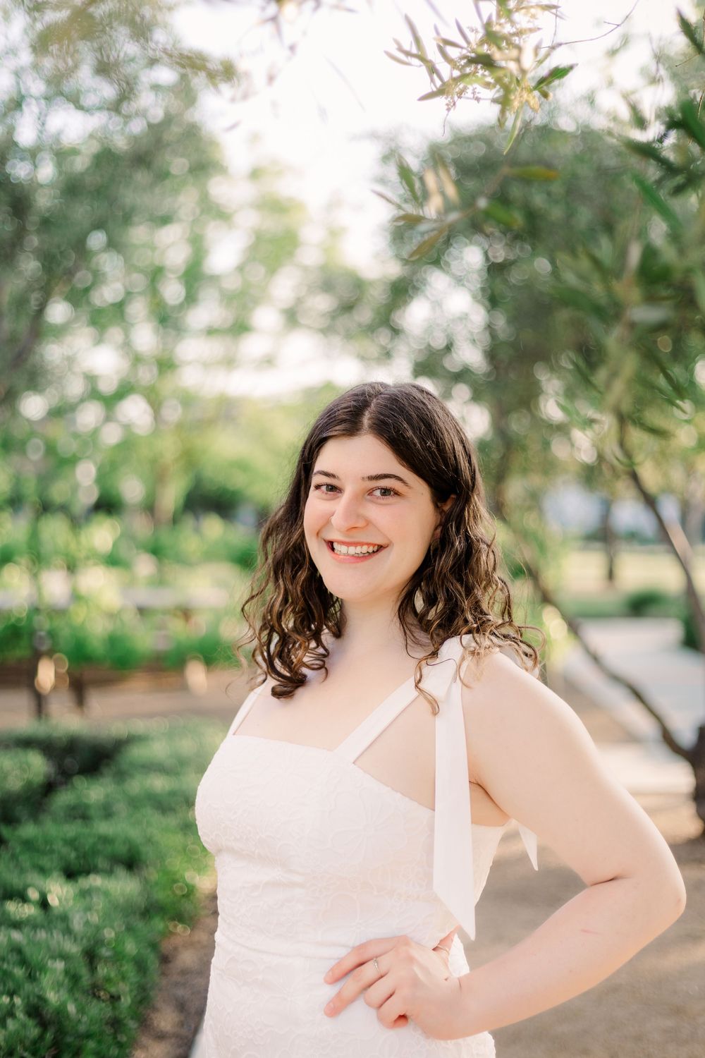 A series of outdoor portrait photographs in a garden setting with soft natural lighting and greenery in the background.