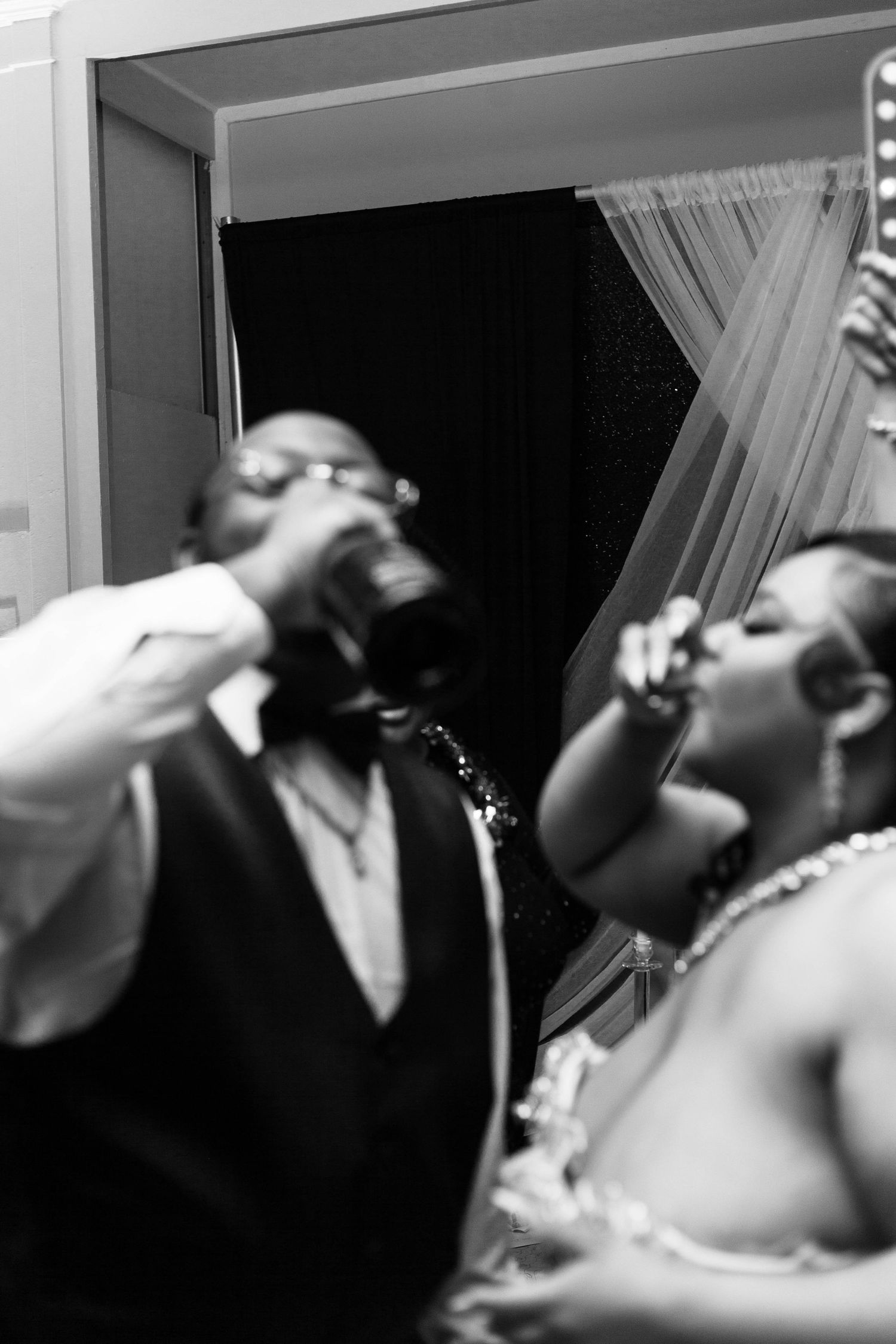 Black and white sequence of shots showing someone taking a drink, tilting their head back in dramatic motion.