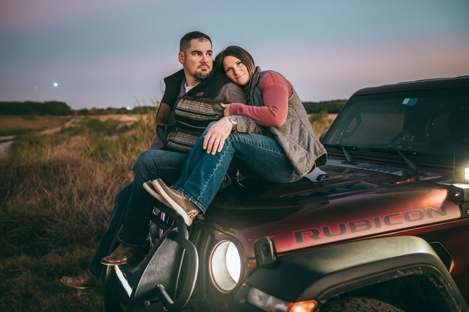 A cinematic couple photoshoot on a Jeep car at sunset with multiple candid poses and intimate moments captured.