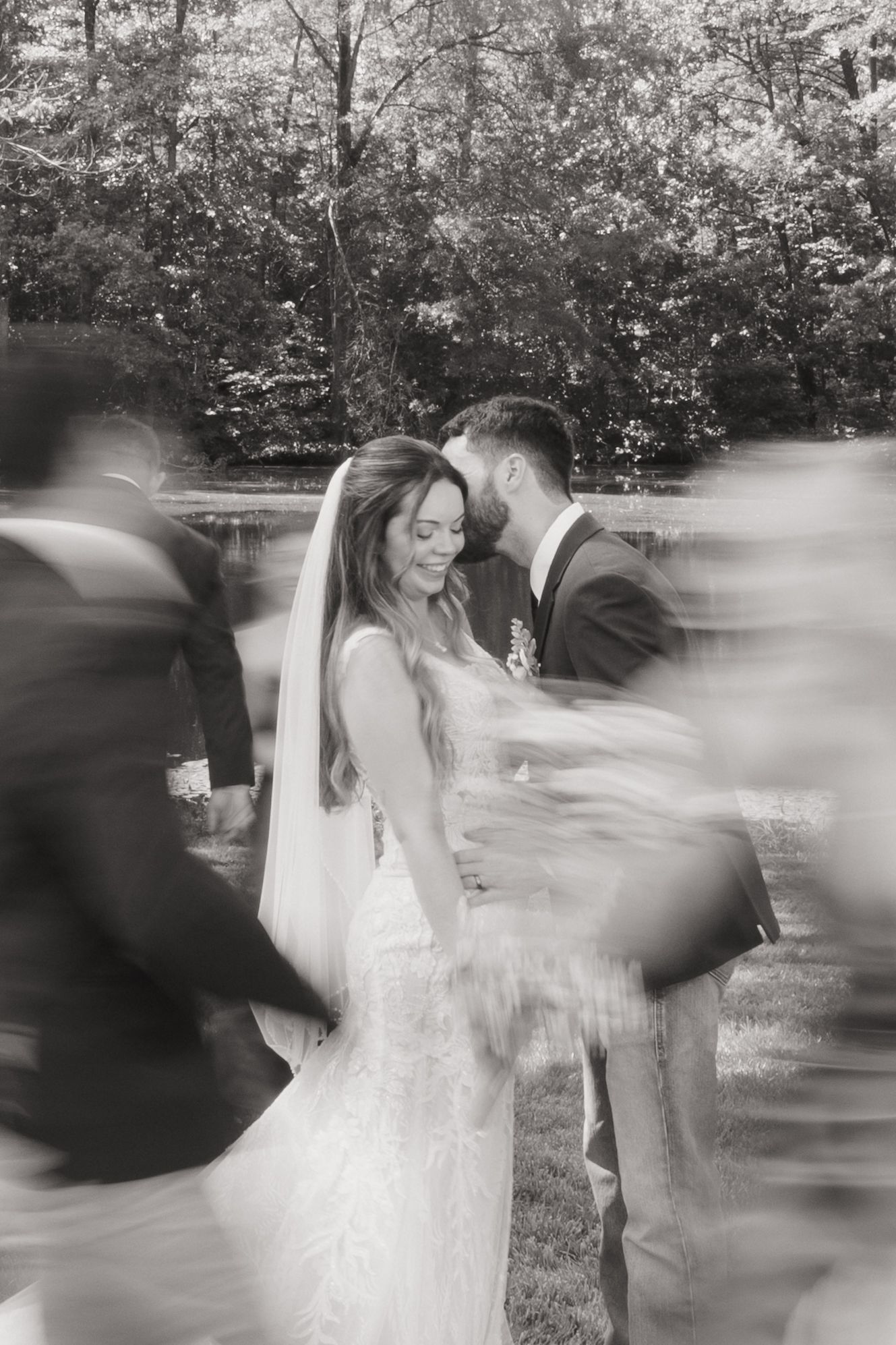 Motion blur wedding photography sequence shows couple dancing together in an outdoor garden setting.