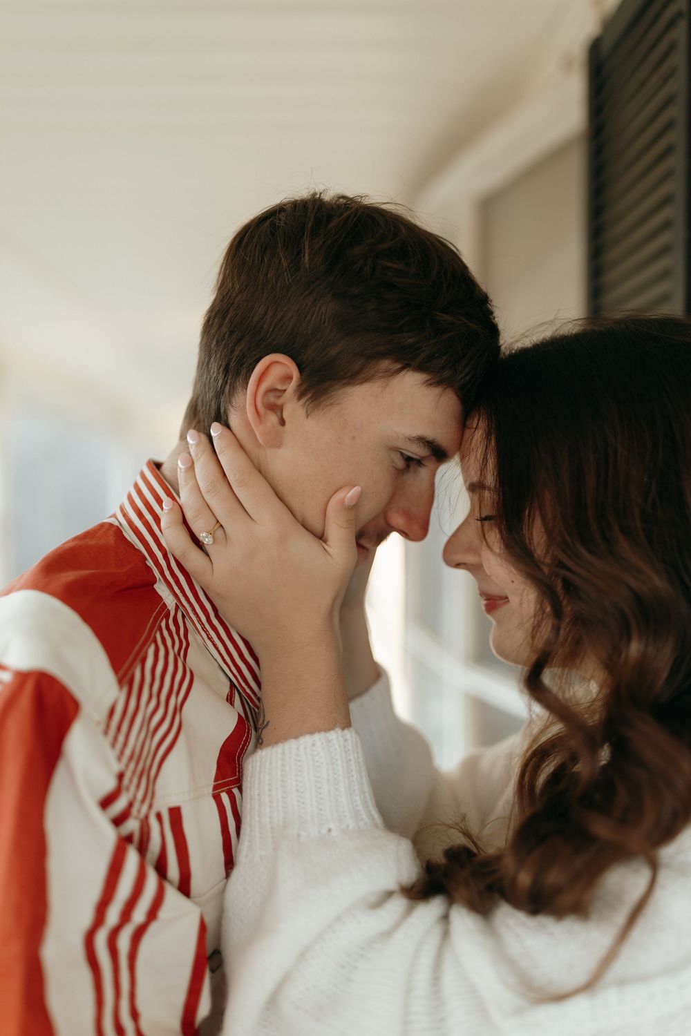 Intimate photo sequence showing a couple in red and white clothing sharing affectionate moments.