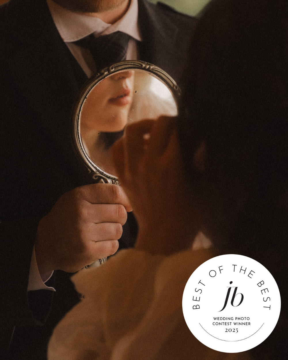 Intimate silhouettes of a couple embracing in dramatic low-key lighting with elegant wedding details.