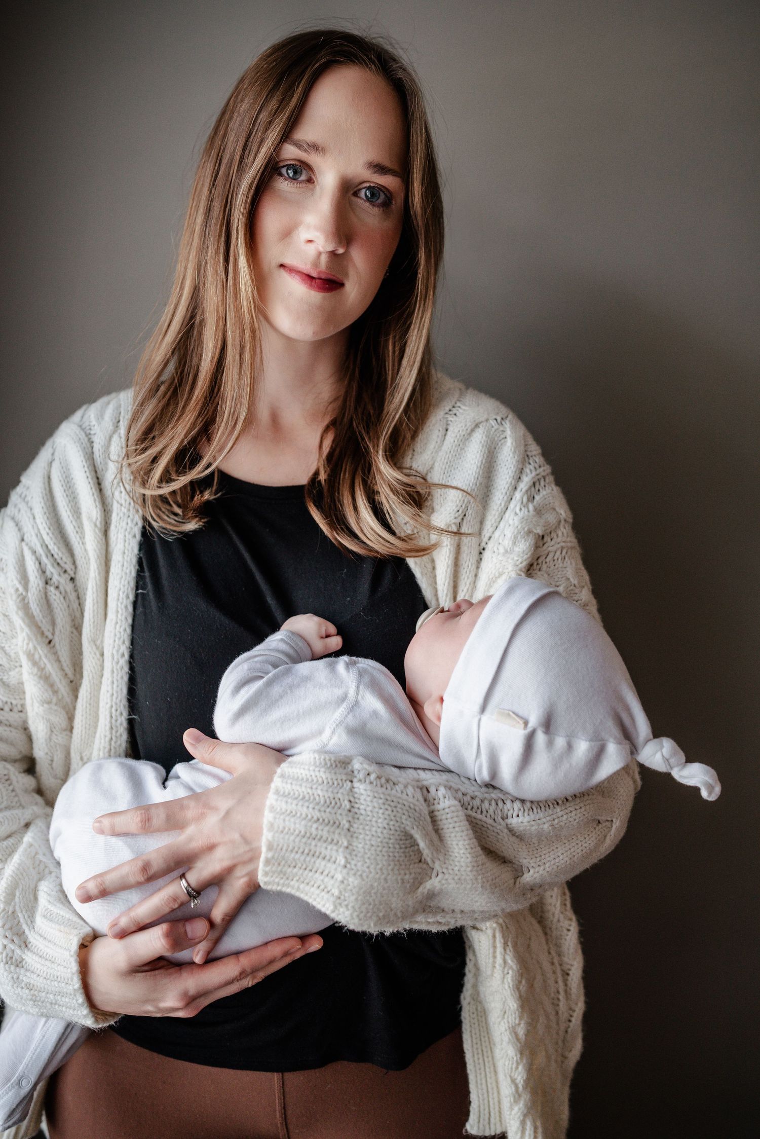 Memphis Family Photographer captures Day in the Life moments for local Mississippi family capturing mother and newborn.