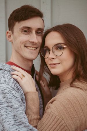 A loving couple in sweaters sharing tender moments in a sequence of close-up photos.