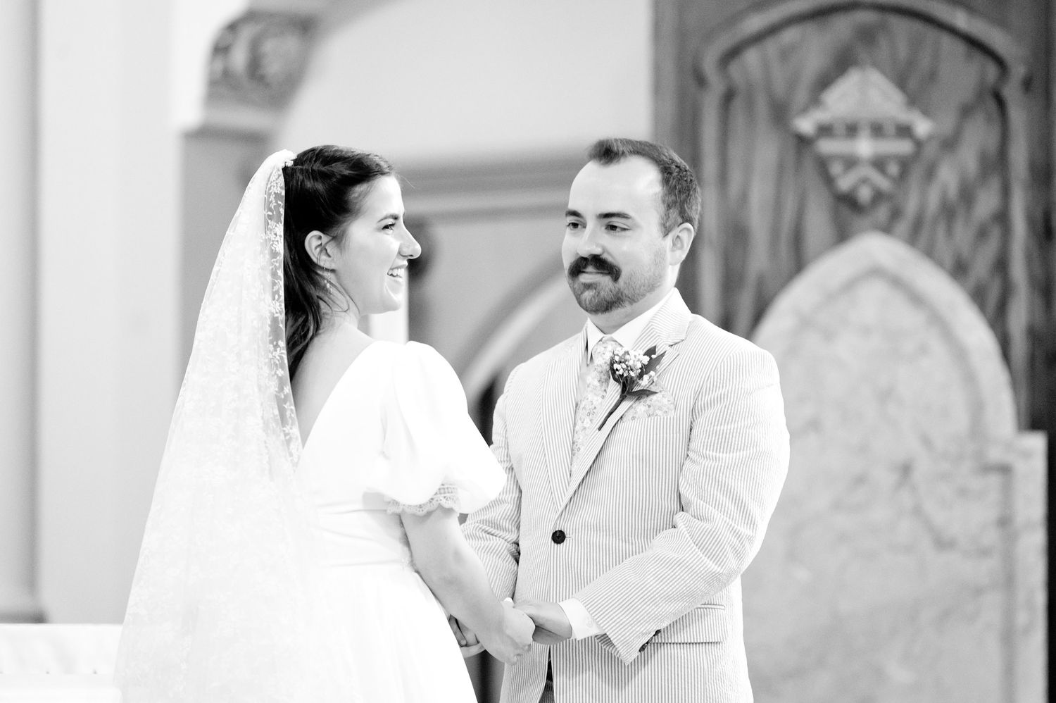 Elegant wedding ceremony moments captured in a church with classic architecture.