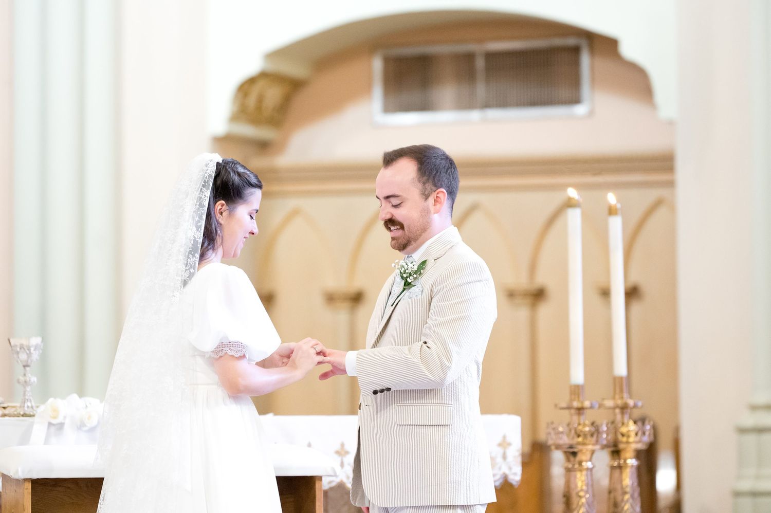 Romantic moments shared in an ornate church interior with classic architectural details.