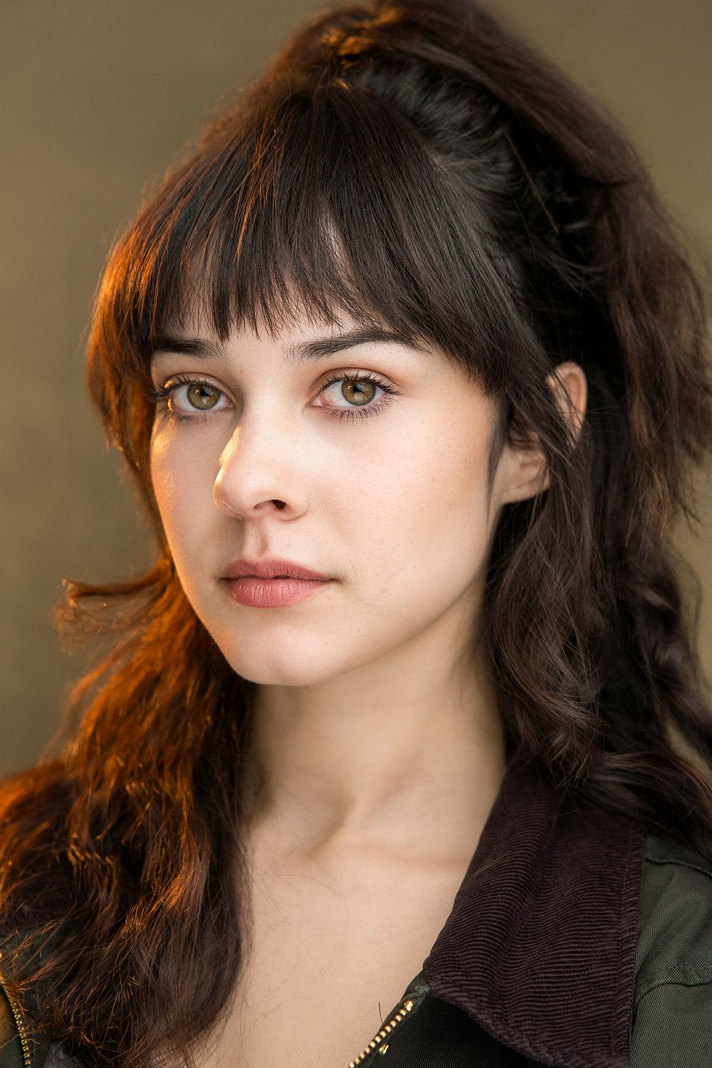 Portrait series showing close-up shots with dark hair and bangs in warm lighting against a simple background.