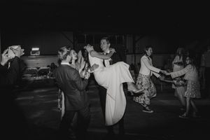 Black and white photo of couples dancing at a vintage social gathering or party on a dance floor.