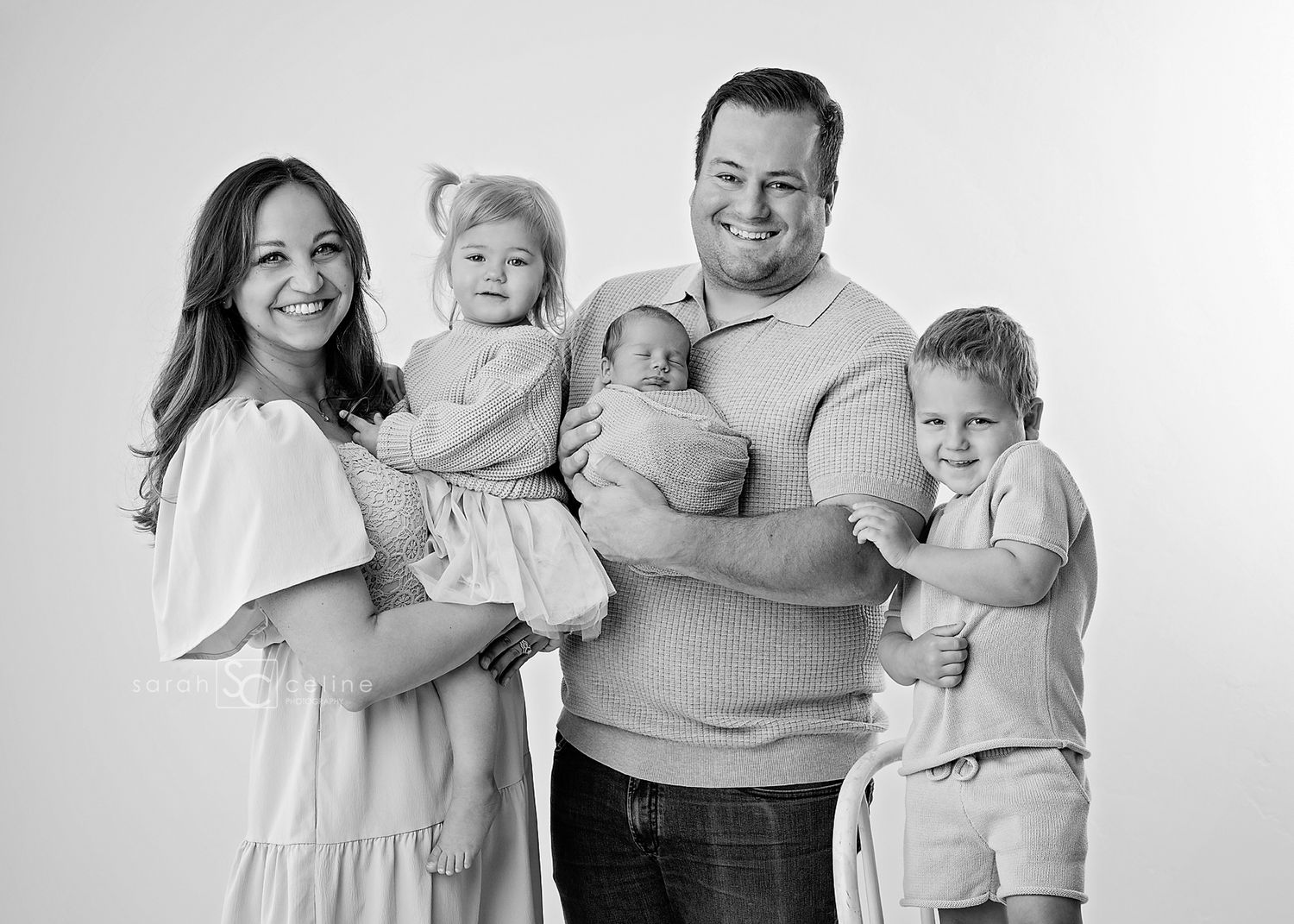 Series of black and white portraits showing family members in casual poses and matching outfits.