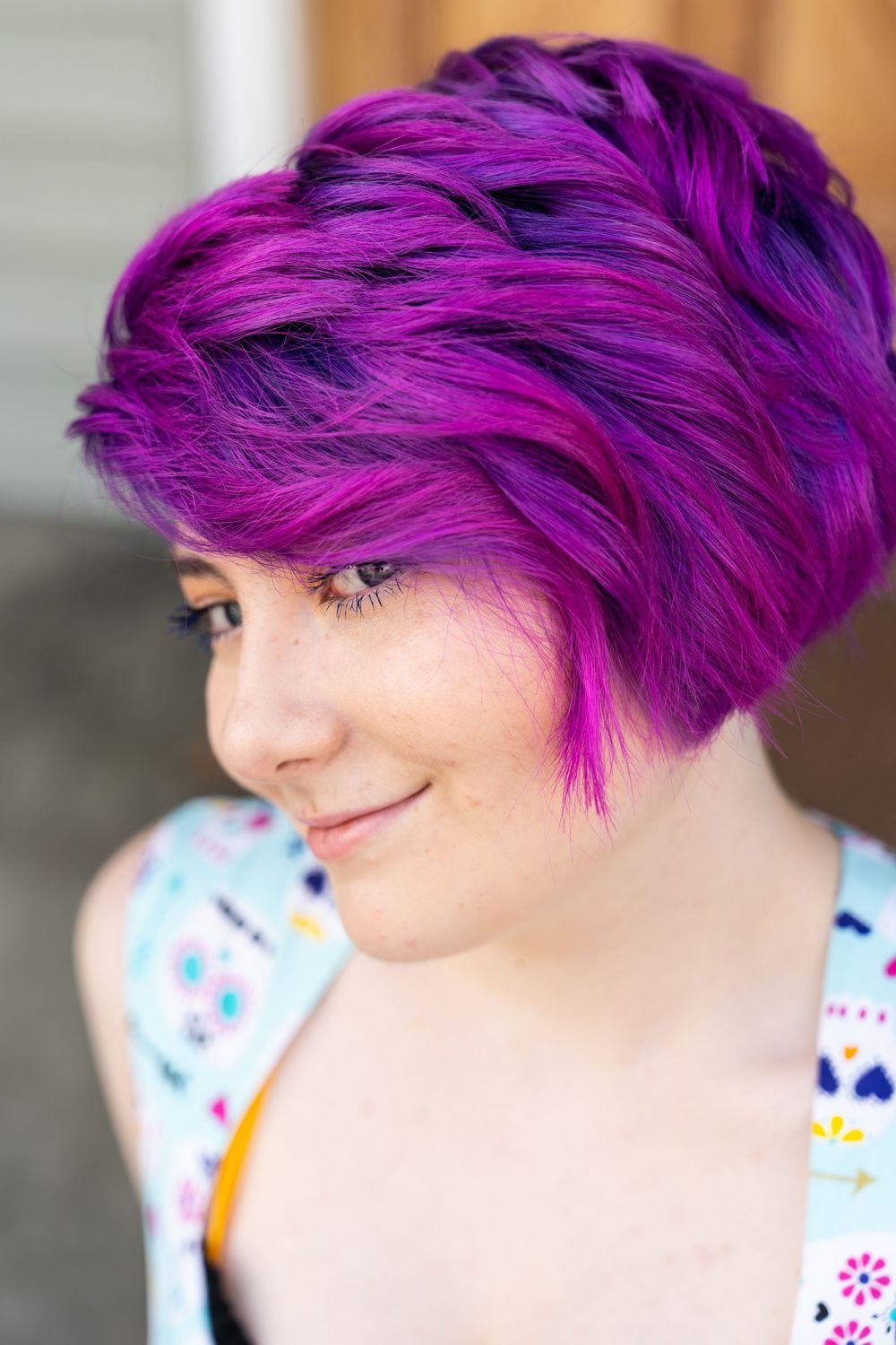 Senior portrait of purpled haired high school girl.