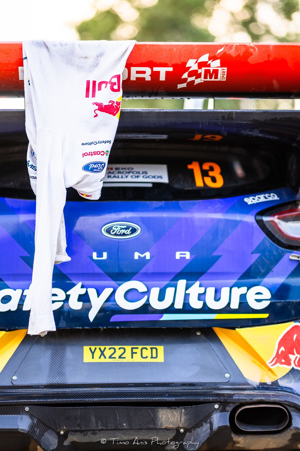 Close-up detail of a race car showing Safety Culture branding and Ford logo with number 13 displayed.