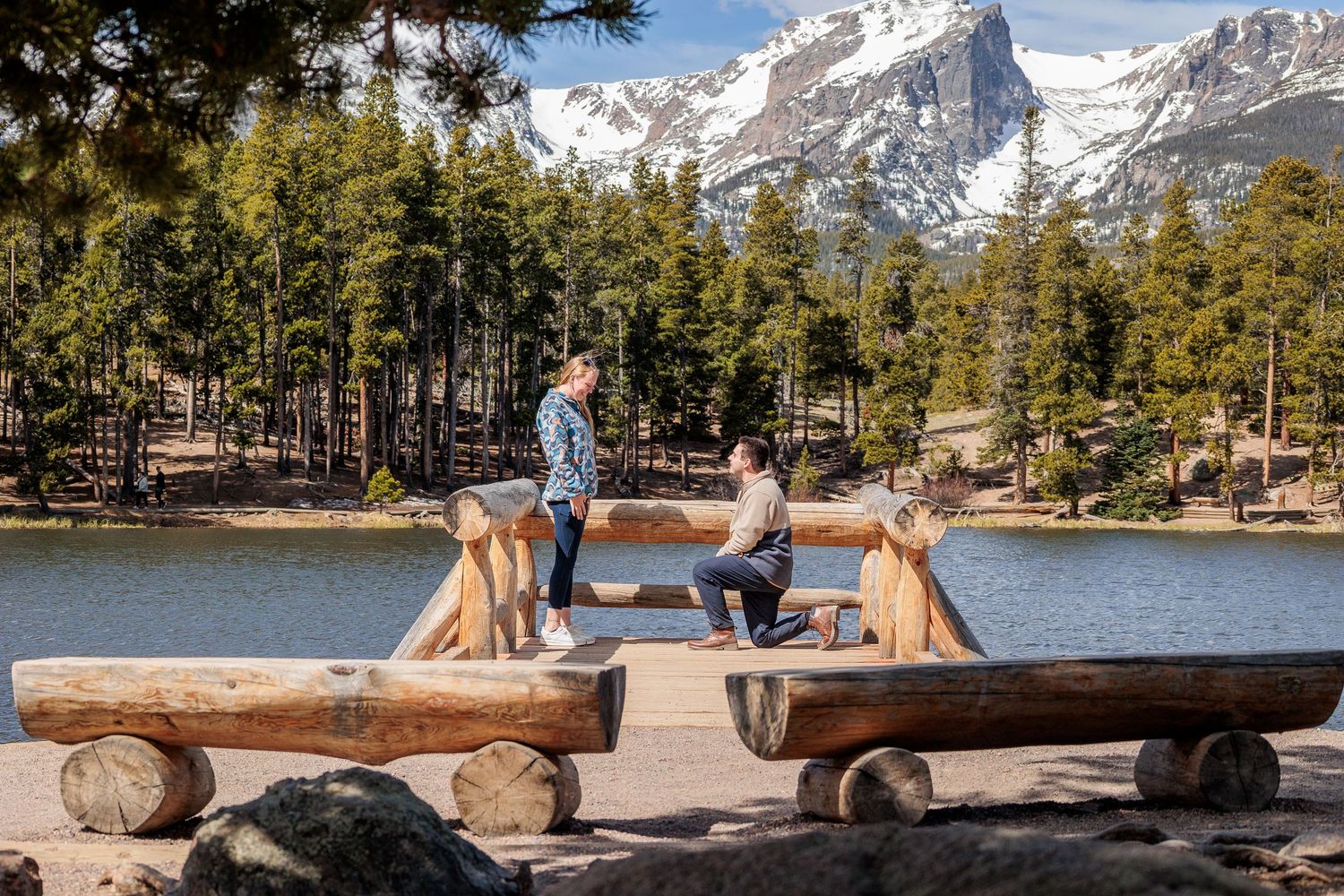 elopement couple by calm Sprague Lake, sunrise reflection of mountains in water, accessible and romantic RMNP location