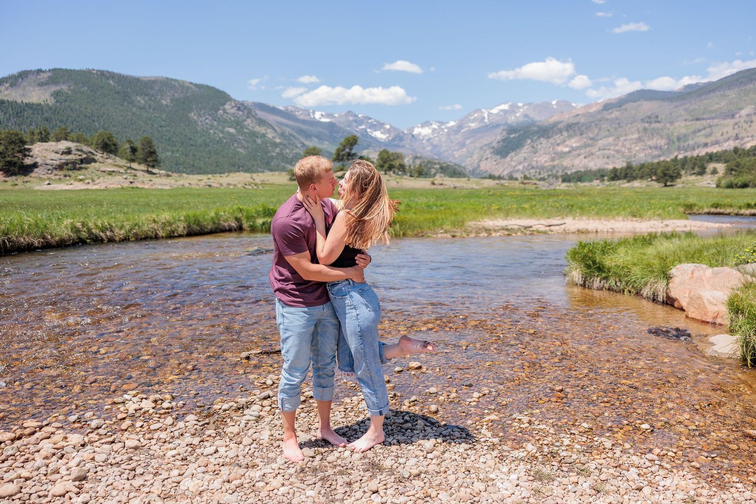 bride and groom in open meadow at Moraine Park, mountain views and elk nearby, fall elopement in Rocky Mountain National Park