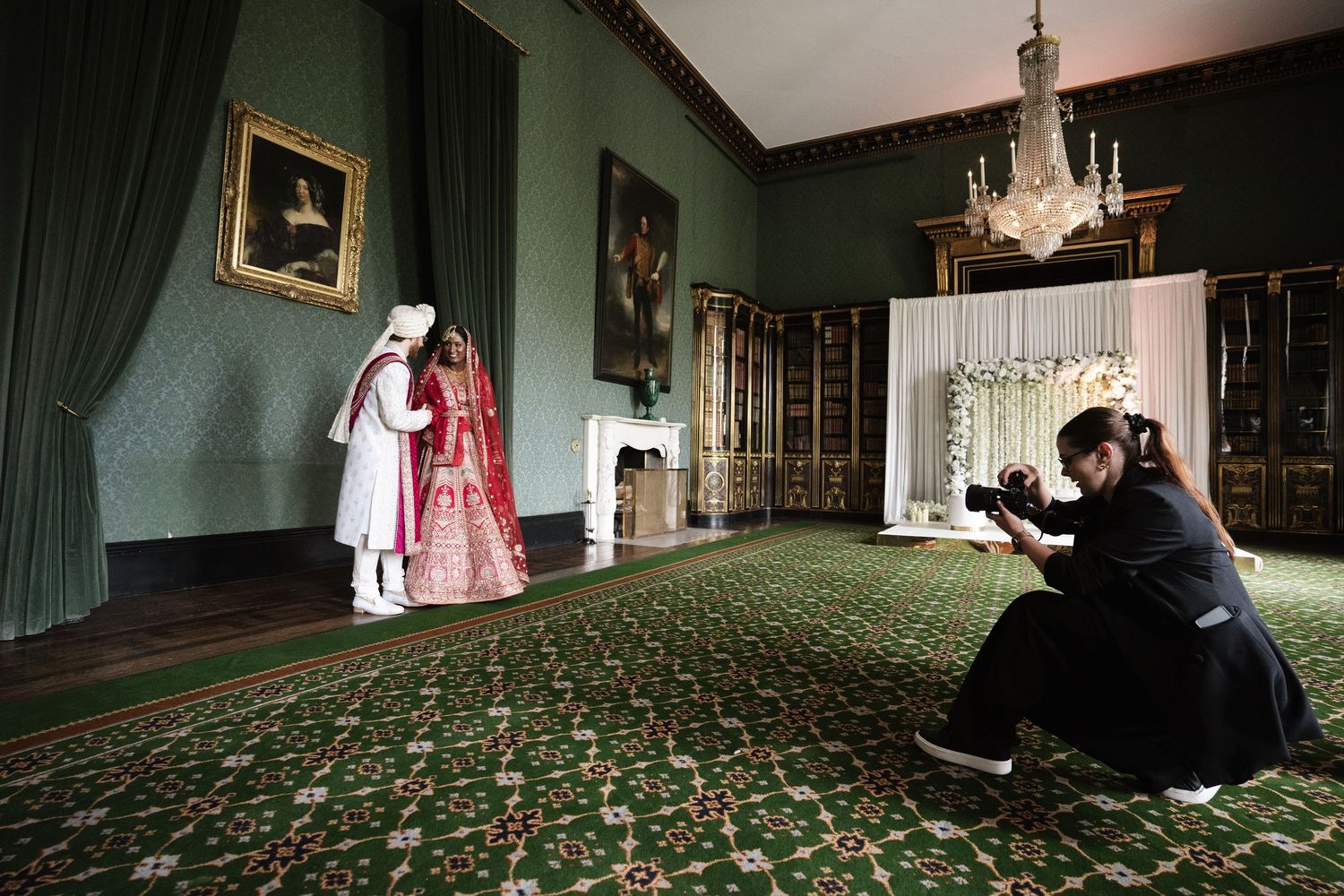 Wedding photography sequence in a dramatic green room with vintage furniture and chandeliers.