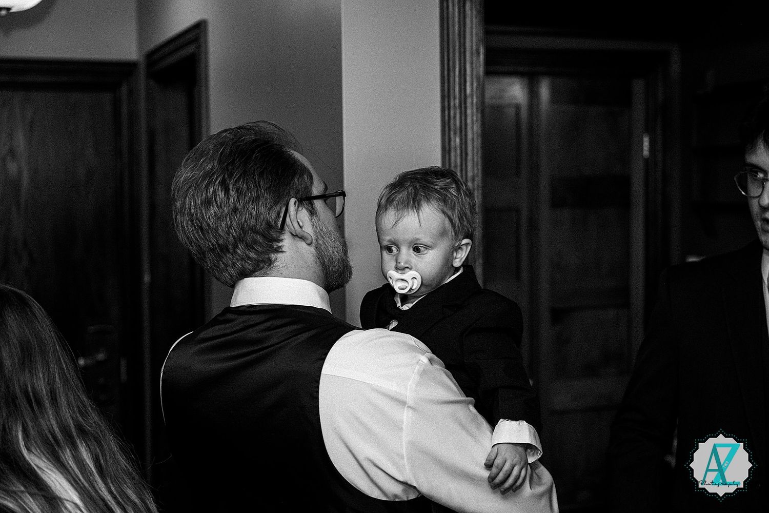 A black and white wedding photography collage showing intimate moments of the newly married couple during their special day.
