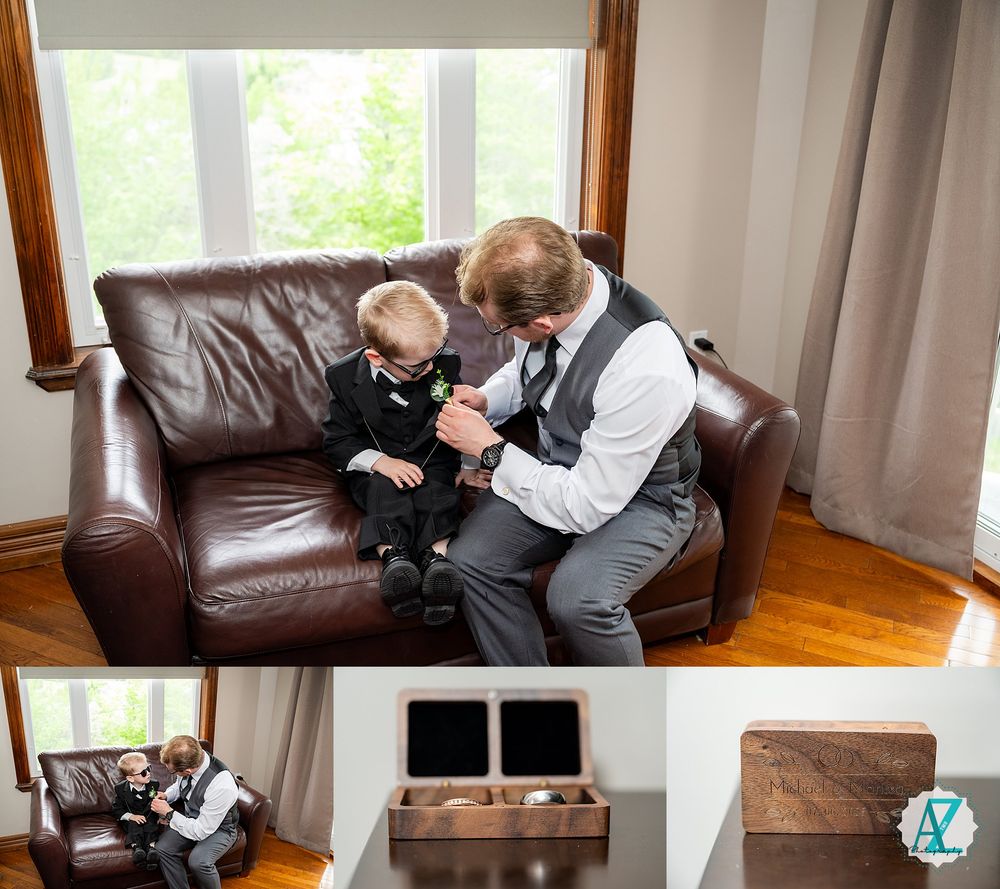 A toddler and formally dressed adult share a tender moment while sitting together on a brown leather couch.