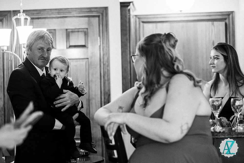 Black and white wedding photos showing tender moments between a bride and groom during their first dance.
