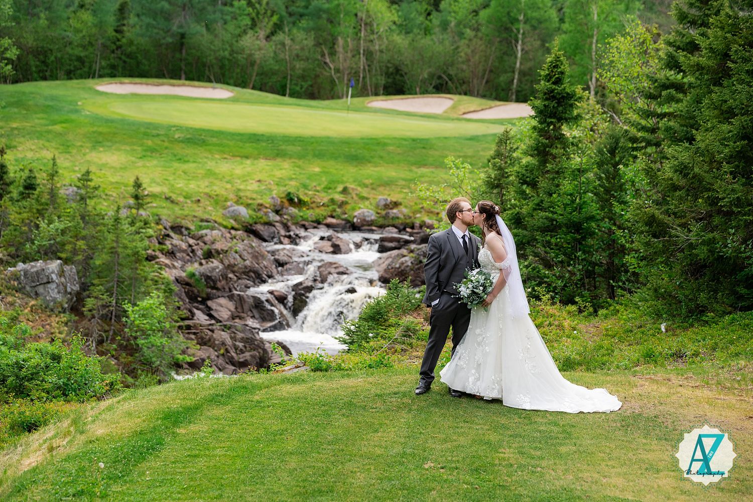 A scenic wedding photo series showing a cascading waterfall and lush green forest backdrop in summer.