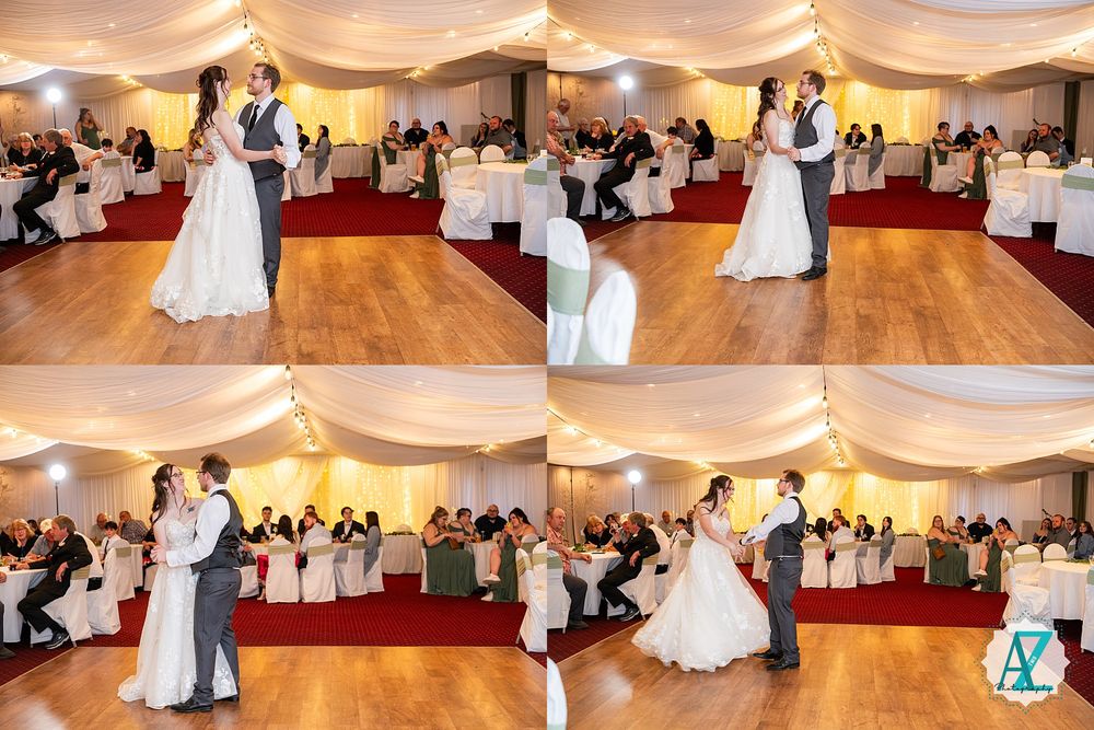 A couple shares a romantic first dance in an elegantly decorated ballroom reception with guests watching from their tables.