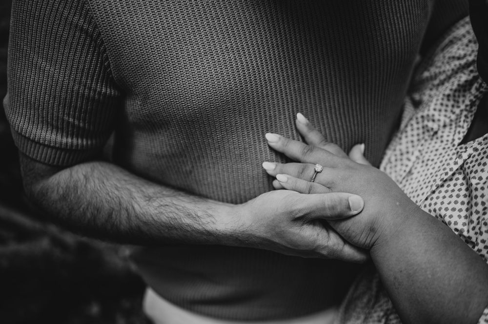 Detail photography of engaged couple hands and engagement ring in Cathedral Groves, MacMillan Park. Vancouver Island adventure photographer