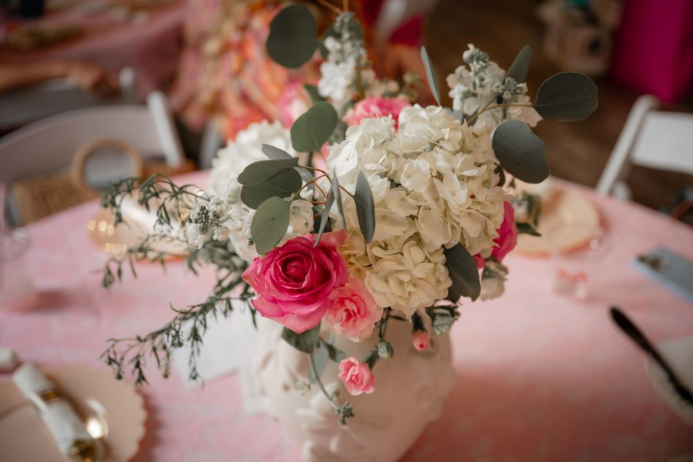 white and pink hydrangea and spray rose floral arrangement at a DFW baby shower