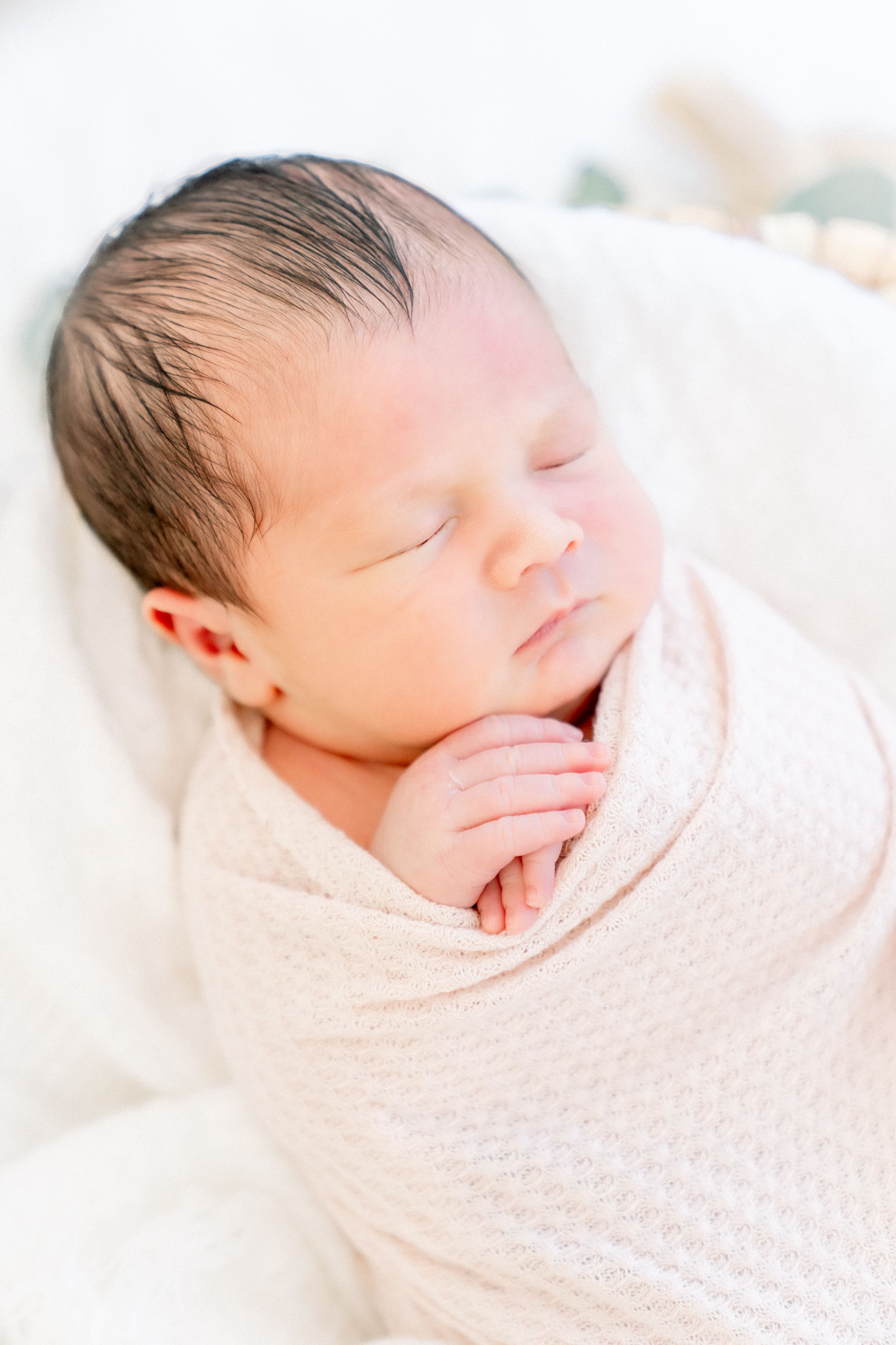 baby boy snuggled up during his newborn lifestyle session in largo florida