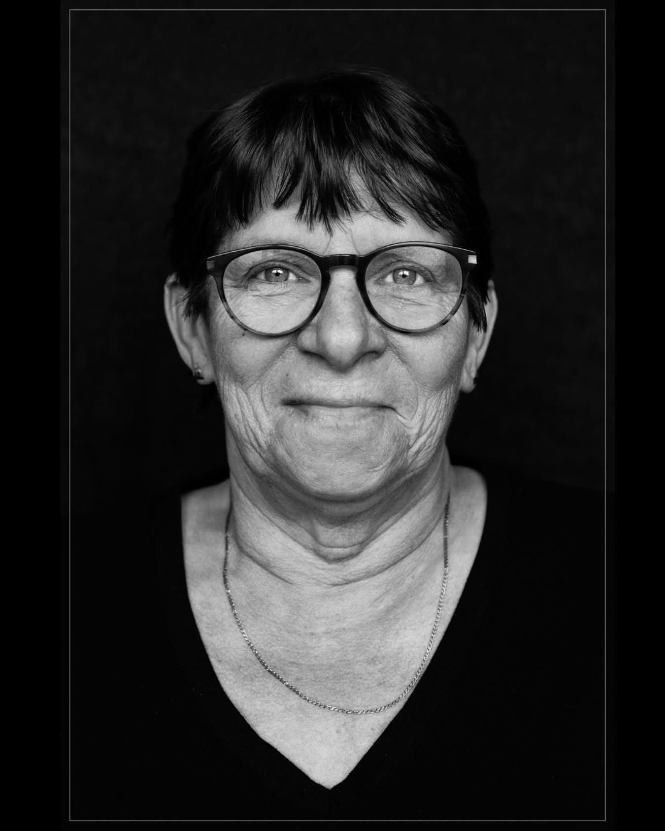 Black and white portrait series showing a person wearing glasses against a dark backdrop.