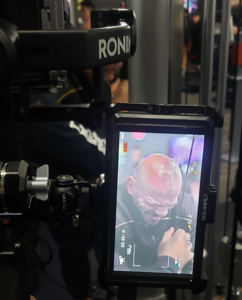 A video camera monitor screen displaying footage on a professional Ronin camera rig setup during production.