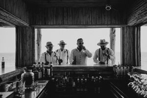 A series of vintage black and white photographs arranged in a filmstrip-style horizontal layout showing various scenes.