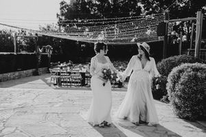 A black and white wedding celebration photo montage showing various moments from the ceremony and reception.