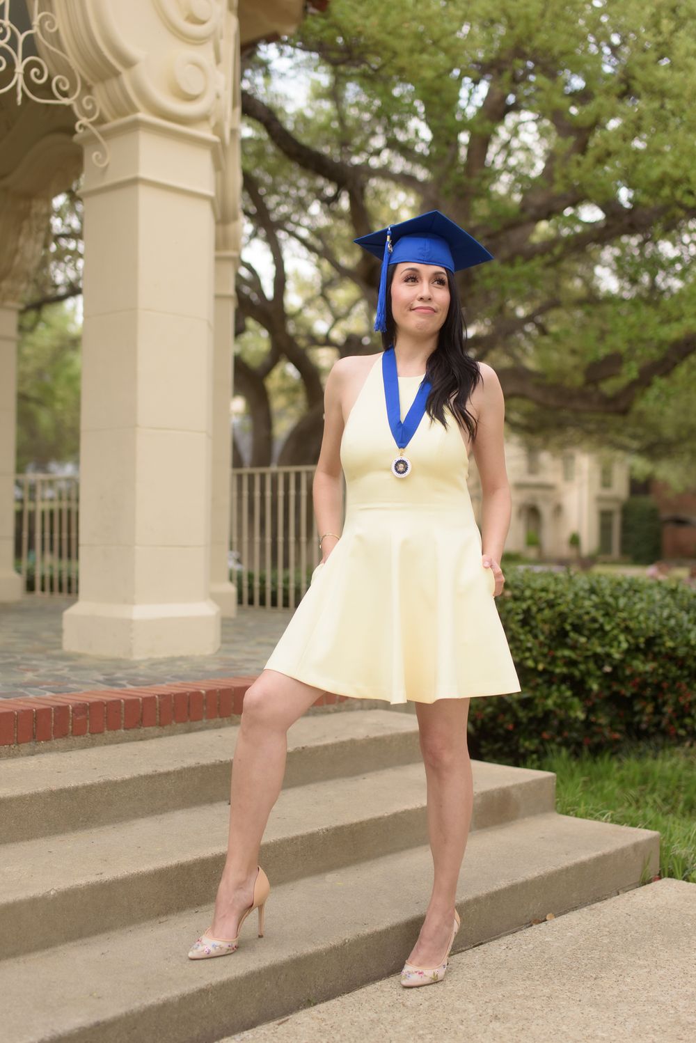 UTA Nursing Graduate in yellow dress