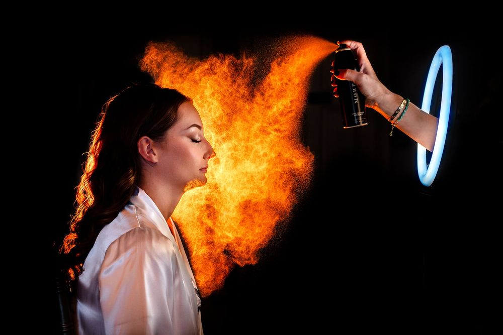 A dramatic sequence of fire breathing performance shots showing bright orange flames against a dark background.