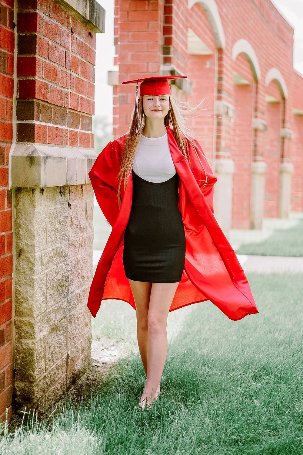 Series of photos showing red graduation gown against brick wall and grass.