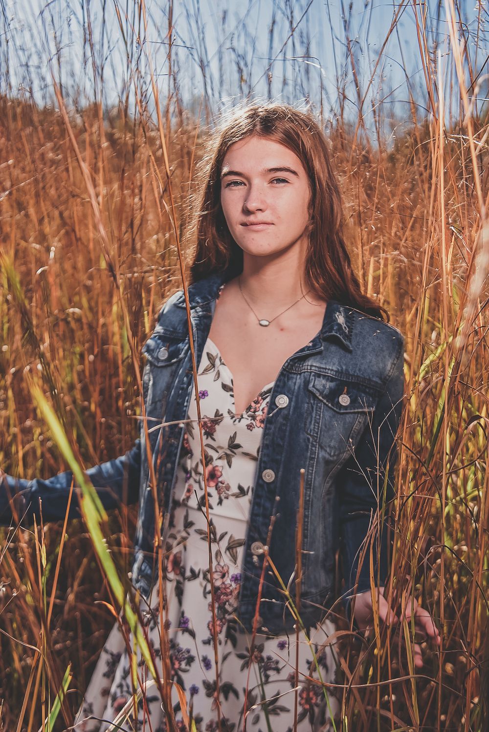 Autumn portrait series among tall dried grasses with denim jacket.