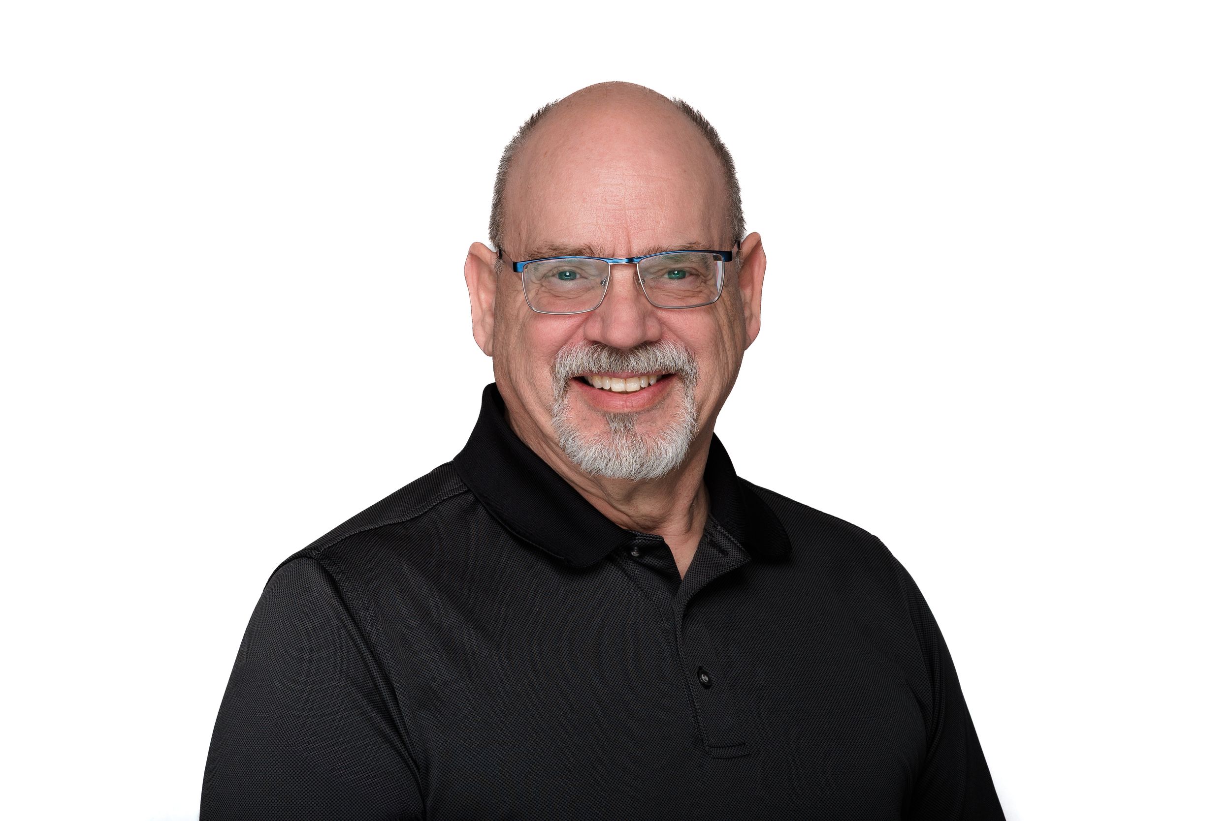Professional portrait of a person with glasses and a beard wearing a black polo shirt.