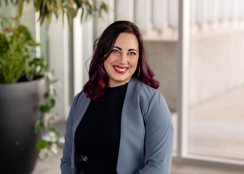 Professional portraits of a person in a grey blazer in a modern office setting.