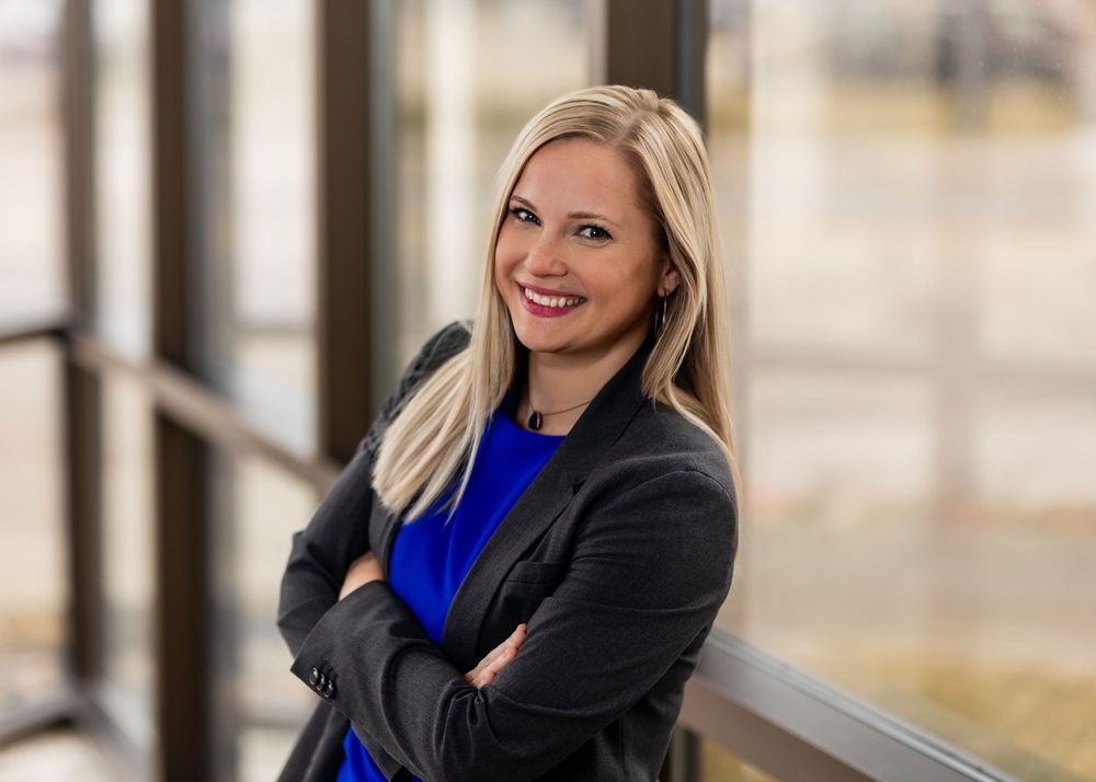 Professional portraits of a person in business attire with a bright blue scarf.