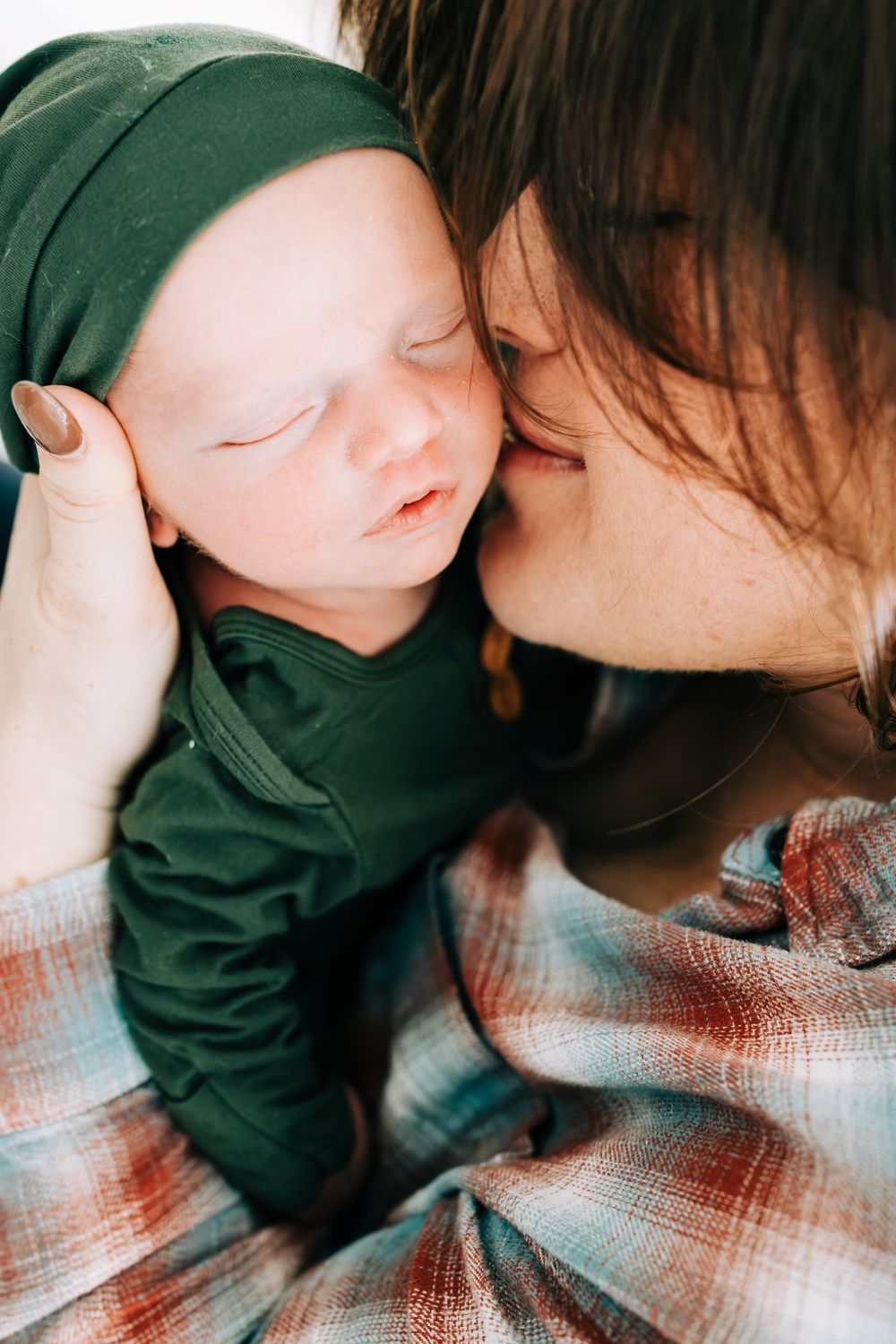 Mom snuggling newborn baby, Nipomo, CA