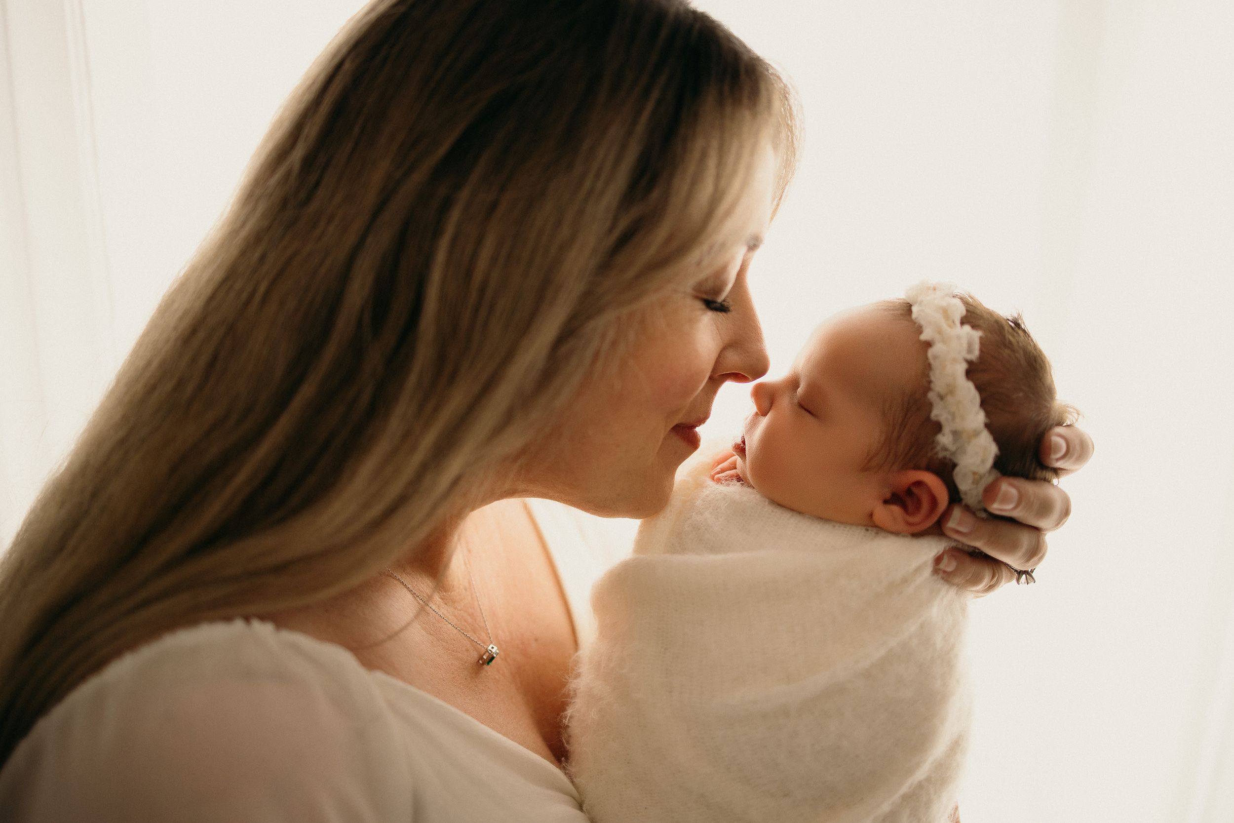 Romantic couple sharing an intimate moment together in soft natural lighting.