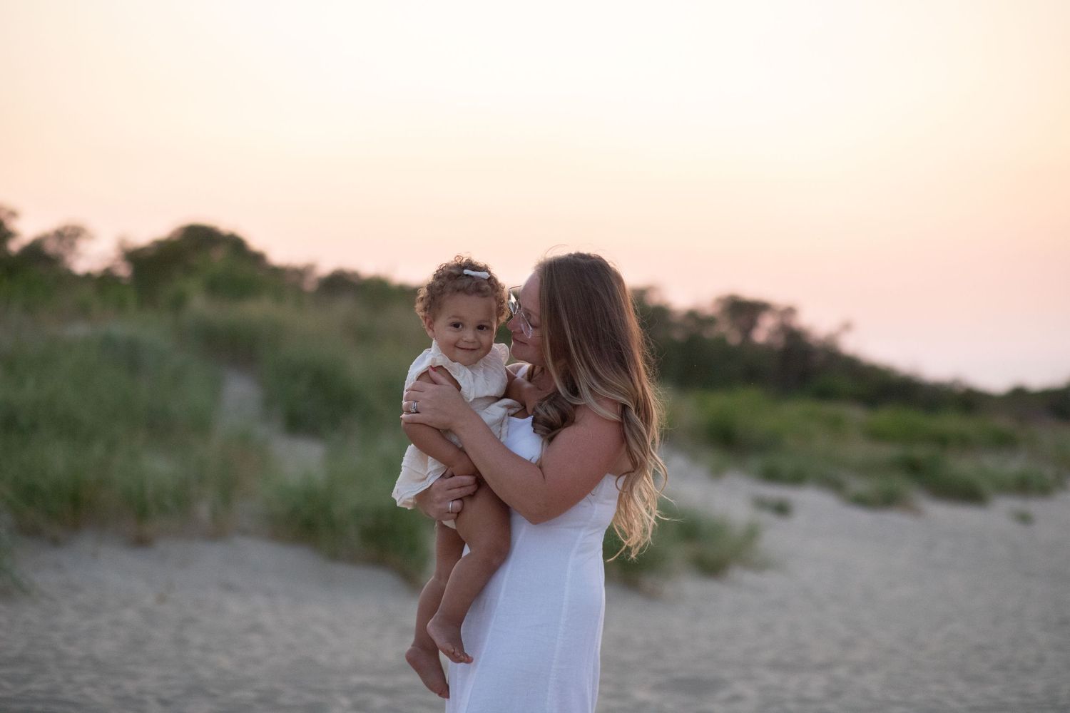 Mom and Baby at the beach during sunset