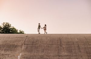 Couple walking on a wall