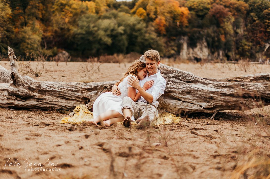 Couple sitting in sand, Cedar Rapids, IA
