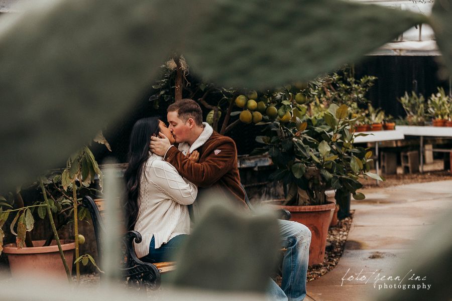 Couple sitting in greenhouse, Cedar Rapids, IA